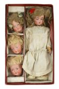 A rare J. D. Kestner bisque character doll, with three interchangeable character heads, German,