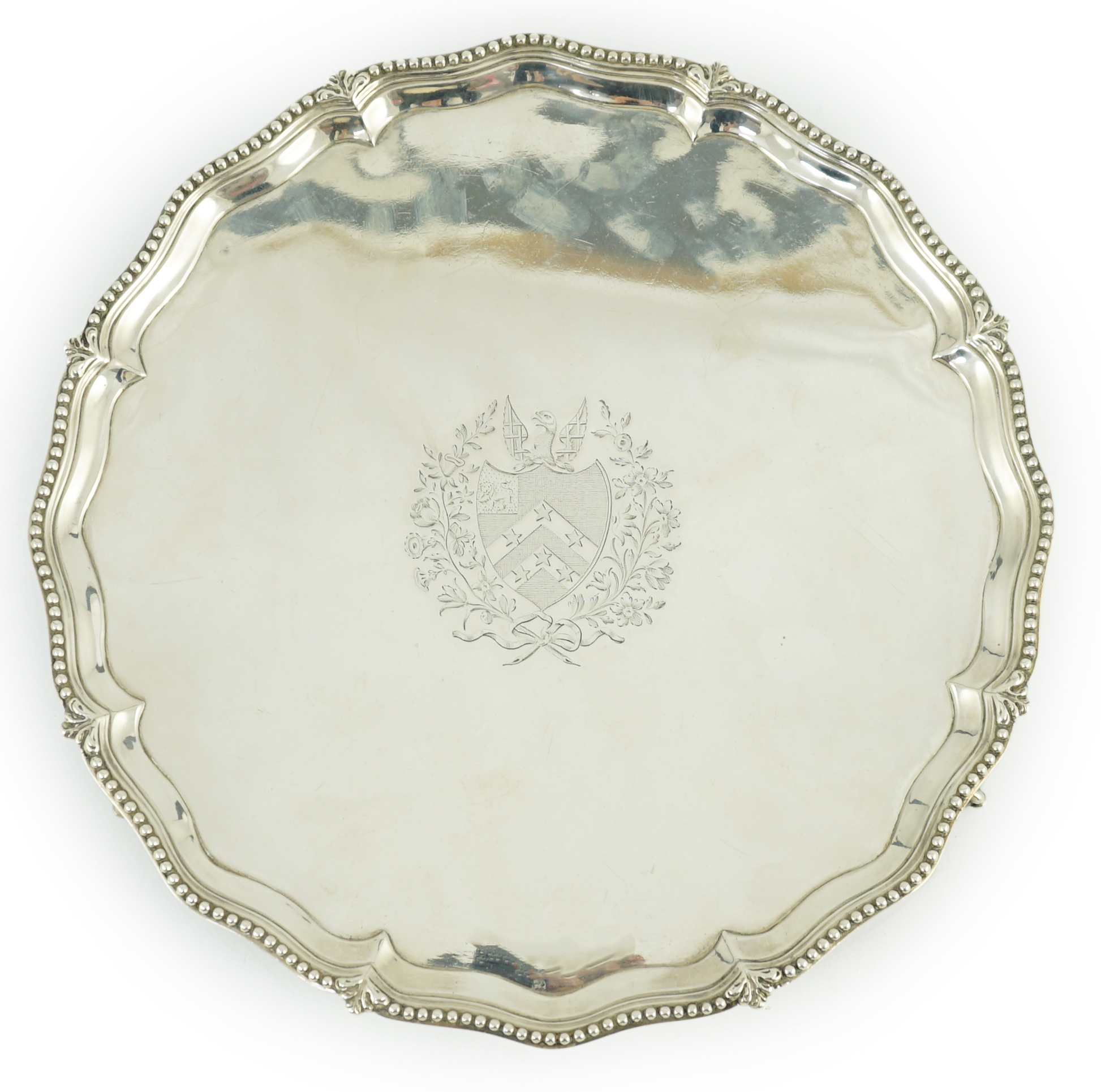 A George III silver salver, by John Crouch I and Thomas Hannam, of shaped circular form, with beaded