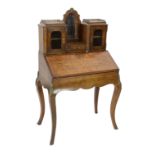 A Victorian marquetry inlaid walnut bonheur du jour, the raised mirrored back with single drawer and