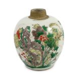 A Chinese famille verte small ovoid jar, Kangxi period, painted with rocks, flowers, foliage and two