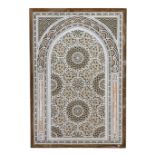 A Hispano Moresque carved marble panel, of arched form with roundel and stylised foliate motifs,