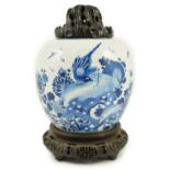 A Chinese blue and white ‘birds and rockwork’ ovoid jar, Kangxi period, painted with three birds