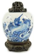 A Chinese blue and white ‘birds and rockwork’ ovoid jar, Kangxi period, painted with three birds