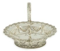 A George III pierced silver oval bread basket, by Charles Aldridge & Henry Green, with engraved