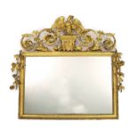 A 19th century carved giltwood wall mirror, with elaborate ornate eagle and flowering swag