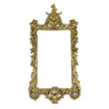 A 19th century Chippendale style carved giltwood wall mirror, with foliate scroll frame and