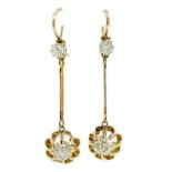 A pair of late 19th/early 20th century gold and four stone diamond set drop earrings, the main