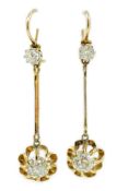 A pair of late 19th/early 20th century gold and four stone diamond set drop earrings, the main