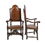 A pair of late 17th century Spanish walnut and elm armchairs, with arched leather covered backs,