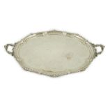 A large Victorian silver oval two handled tea tray, by Hawksworth, Eyre & Co, with engraved