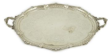A large Victorian silver oval two handled tea tray, by Hawksworth, Eyre & Co, with engraved
