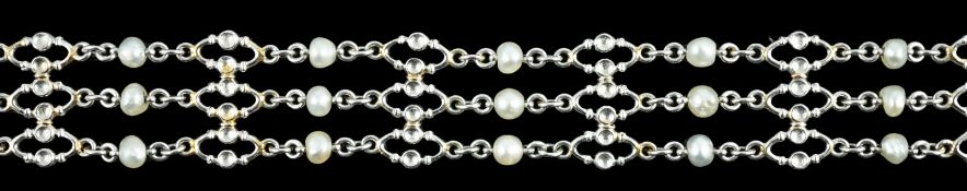 An early to mid 20th century white gold and seed pearl set three row chain link bracelet, 18.8cm,
