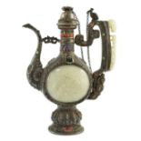 A Tibetan silver, jade, coral and hardstone mounted ewer, late 19th century, the Chinese pale