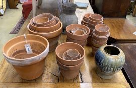 Approximately 40 assorted small terracotta pots, largest diameter 26cm, height 21cm together with