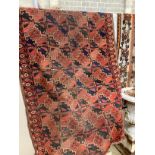 An antique Beshir Turkoman red ground rug 200cm x 109cm.