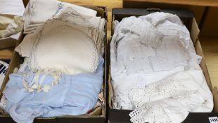 A 19th century white worked and hand made lace christening gown with a collection of table linens