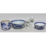 A Chinese pottery figure of a Sage, a blue and white brush pot and two bowls, sage 16cm high