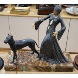 An Art Deco figure and dog, by G. Gori, on marble base, 55cm wide x 53cm high