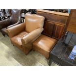 A contemporary brown leather upholstered armchair, width 84cm, depth 86cm, height 90cm and a