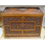 A Victorian carved walnut stationery case with Bramah lock, 42cm wide