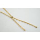 A modern 9ct gold graduated twin tassel necklace, 65cm, 15.7 grams.