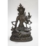 A Buddhist metal figure of ‘Green Tara’, 32cm high