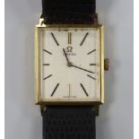 A gentleman's 18k Omega manual wind rectangular dress wrist watch, on associated leather strap, case