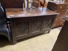 An 18th century carved panelled oak coffer, length 130cm, depth 54cm, height 72cm