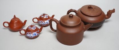 Five early 20th century Chinese Yixing teapots, widest 20cm