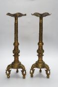 A pair of Chinese bronze altar sticks, 41.5cm high