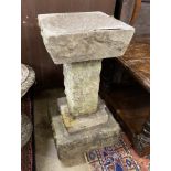 A reconstituted stone granite effect bird bath, height 58cm