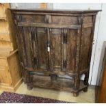 A 17th century style panelled oak side cabinet constructed from old timber, width 157cm, depth 29cm,