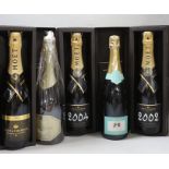 A boxed bottle of Moët 2004 and two bottles of 2002, a boxed Fonsec Vintage port 1996 and a Landon,