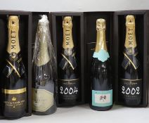 A boxed bottle of Moët 2004 and two bottles of 2002, a boxed Fonsec Vintage port 1996 and a Landon,