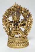 A Sino Tibetan gilt bronze group of Mahakala and consort, 22cm