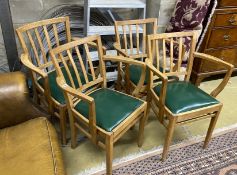 A set of four mid century beech elbow chairs, width 54cm, depth 40cm, height 82cm