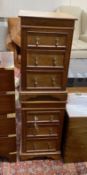 A pair of stained pine three drawer square bedside chests, width 39cm, height 66cm- David to