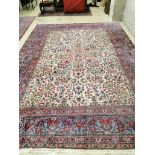 A Persian Kirman ivory ground carpet, 380 x 272cm