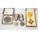 A cased presentation medal, together with a WWI medal pair and a cased RMS Lusitania medallion