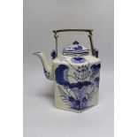 A Chinese blue and white oversized hexagonal teapot, with brass fitted handle and floral decoration,