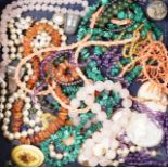 Sundry jewellery including malachite and rose quartz necklaces and unmounted cameos, etc.