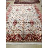 A Kashan ivory ground carpet, 340 x 254cm