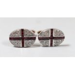A modern pair of 9ct gold, ruby and diamond cluster set oval cufflinks, with cross motif, 21mm,