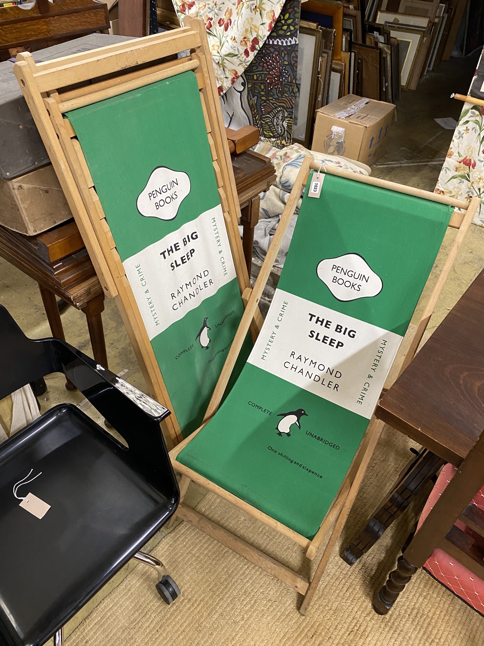 Three 'Penguin books' deck chairs