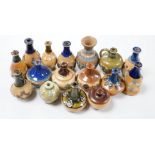 Sixteen Royal Doulton miniatures vases and a jug, tallest 9cm