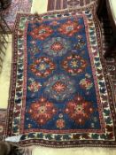 A Caucasian Seychour blue ground rug, 144 x 98cm