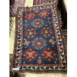 A Caucasian Seychour blue ground rug, 144 x 98cm