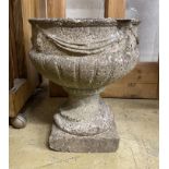 A circular reconstituted stone garden planter with swagged body, diameter 35cm, height 43cm