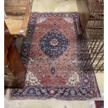Two antique North West Persian rugs together with a Caucasian style rug, largest 224 x 162cm