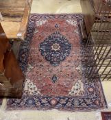 Two antique North West Persian rugs together with a Caucasian style rug, largest 224 x 162cm